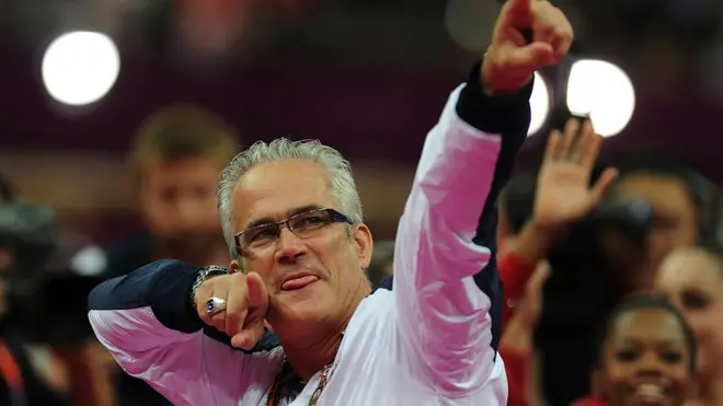 John Geddert celebrates with the US Olympic gymnast team at the London Games in 2012