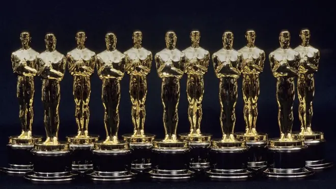 A view of 11 Oscars statues lined up next to each other in 1990 in Los Angeles, California.
