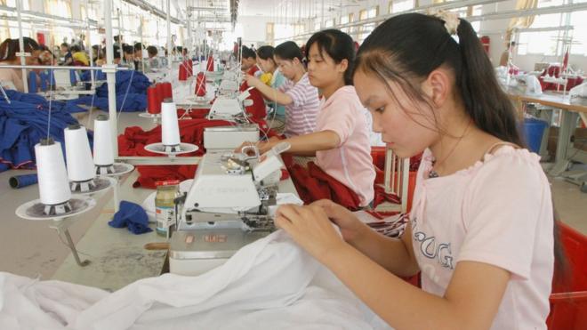Women sew in a factory in China
