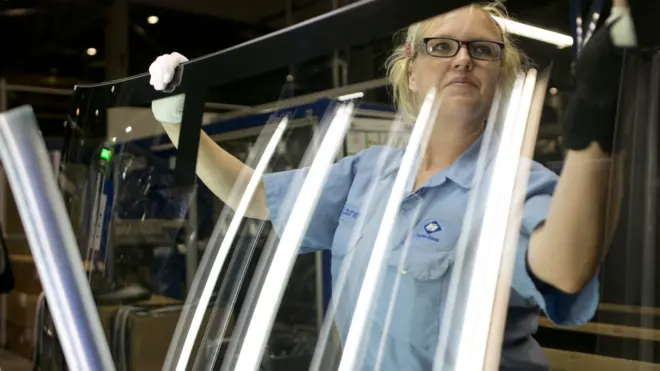 Lauren Hartley cleans and inspects glass at Fuyao Glass in Moraine, Ohio on September 29, 2016