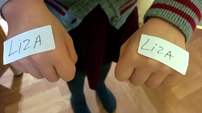 Руки с наклейками