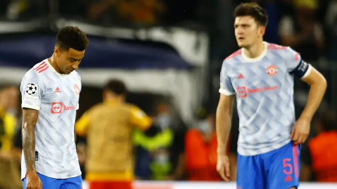 Manchester United's players react after losing to Young Boys in the Champions League