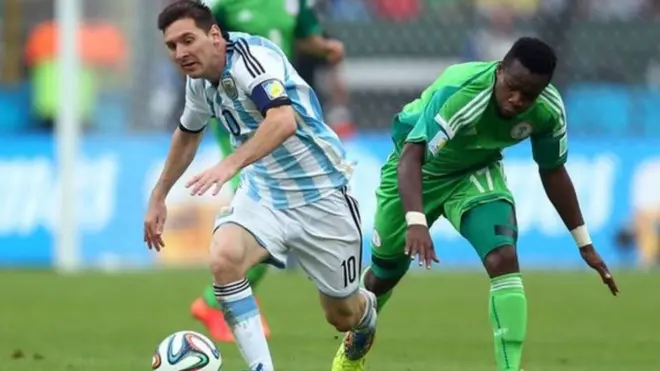 Argentina great Lionel Messi run after di ball with Nigeria Ogenyi Onazi for di 2014 World Cup inside Brazil.