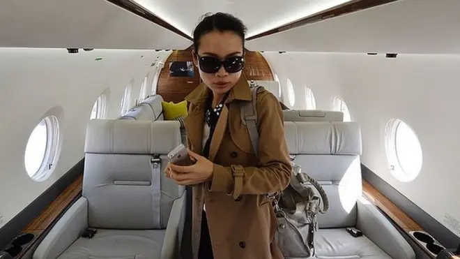 A Chinese woman on a luxury jet