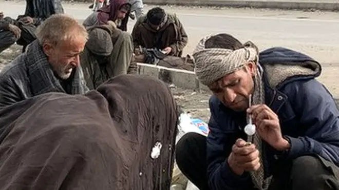 Drug users gather on the side of the road in the capital, Kabul