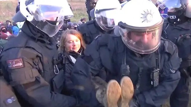 Greta being carried by police