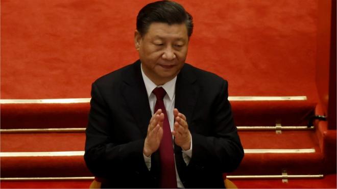 Chinese President Xi Jinping applauds at the closing session of the Chinese People"s Political Consultative Conference (CPPCC) at the Great Hall of the People in Beijing, China March 10, 2021.