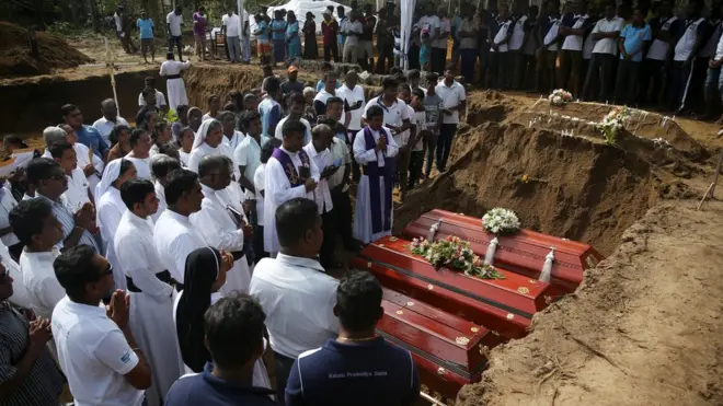 Mourners attended a funeral near St. Sebastian Church in Negombo