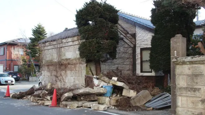 A collapsed wall of a house is seen in Soma, Fukushima prefecture on March 17, 2022 after a 7.3-magnitude earthquake jolted east Japan the night before.