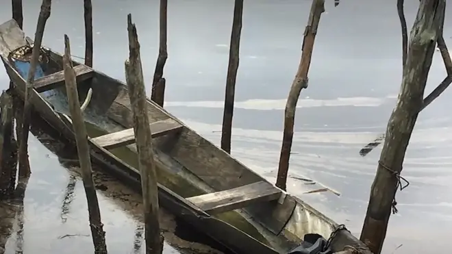 Canoe on top river wey oil dey