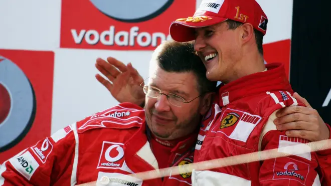 Brawn junto a Schumacher en un podio