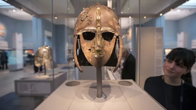 A woman views the Sutton Hoo Helmet on display in the new gallery 'Sutton Hoo and Europe AD 300-1100' in the British Museum