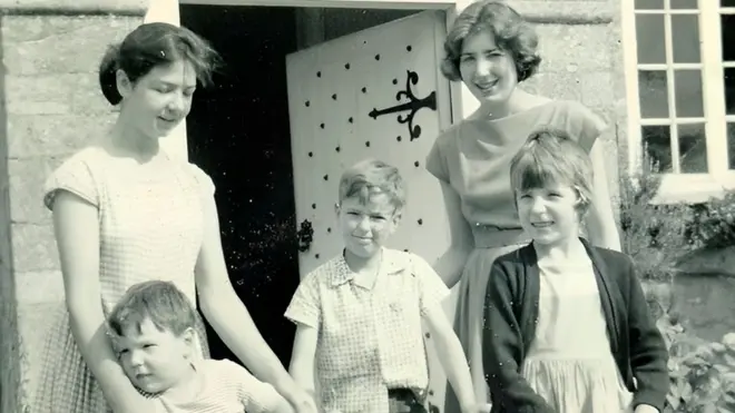 Five of the seven Martin children who grew up with the monarch's bed in their home