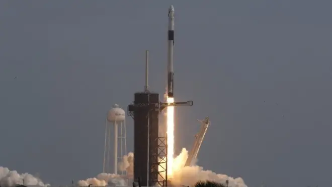 A SpaceX Falcon 9 rocket, carrying the Crew Dragon astronaut capsule, lifts off on an in-flight abort test from the Kennedy Space Center in Cape Canaveral