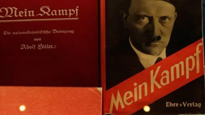 Mein Kampf ฉบับพิมพ์ครั้งแรก ซึ่งเรียกร้องให้คนเยอรมันล้างแค้นต่อความพ่ายแพ้ในสงครามโลกครั้งที่หนึ่ง