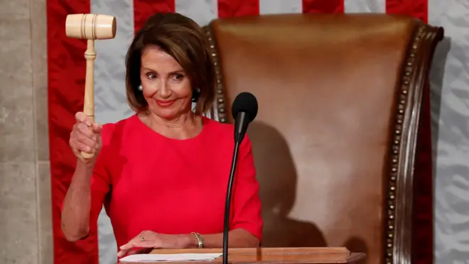 Nancy Pelosi raises the gavel after being elected as House Speaker