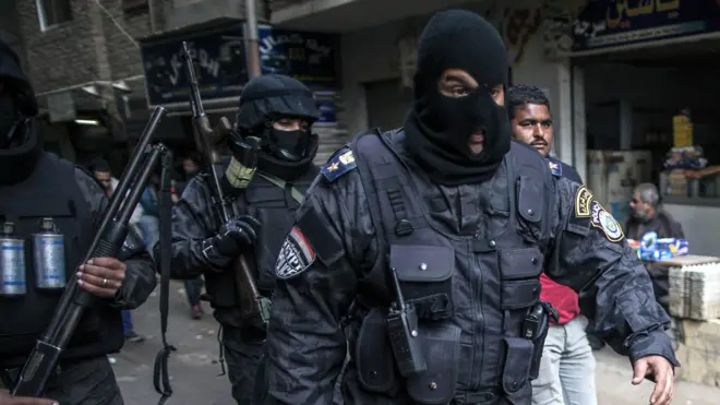 Egyptian police special forces patrol streets in al-Haram district of Giza on 25 January 2016