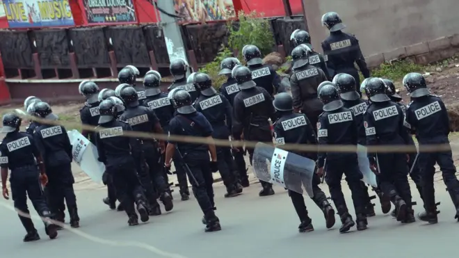Riot police patrol for streets for Buea