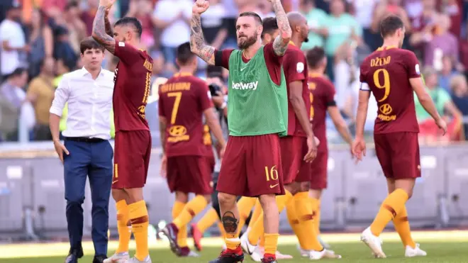 Nigerians go dey wonder if true true AS Roma chop jollof rice on Saturday night afta dem beat Lazio