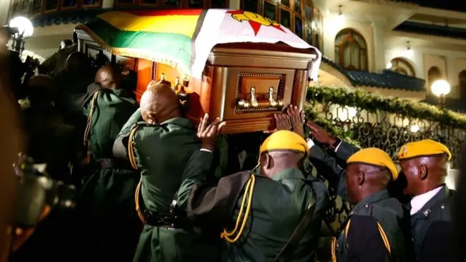 The body of former Zimbabwean President Robert Mugabe arrives at the Blue Roof, his residence in Borrowdale, Harare, Zimbabwe, on 11 September 2019