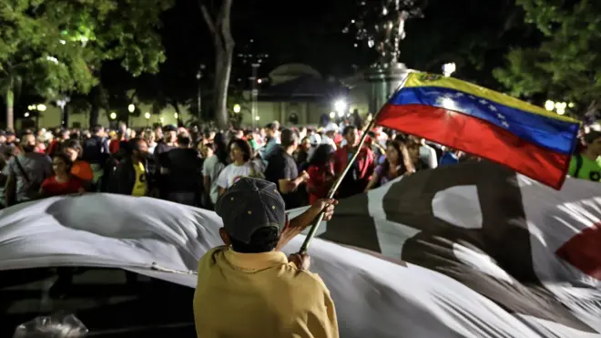 Government supporters celebrate at the end of voting day in the Plaza Bolivar of Caracas, Venezuela, 30 July 2017