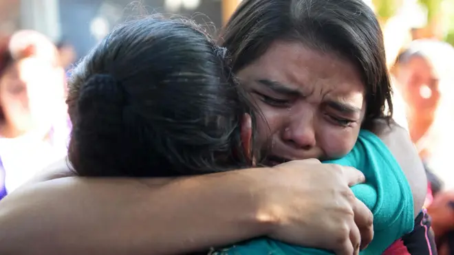Imelda Cortez (R) is embraced by relatives after she was acquitted and released