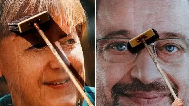 ในการโต้วาทีแสดงวิสัยทัศน์ นายมาร์ติน ชูลซ์ (ขวา) ทำได้ไม่ดีนัก