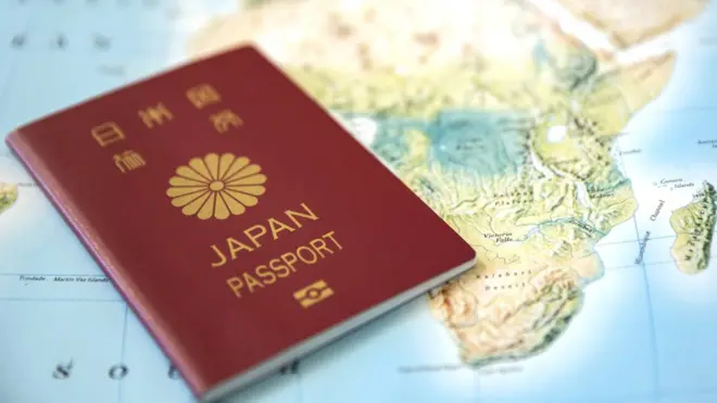 Japanese passport on a world map