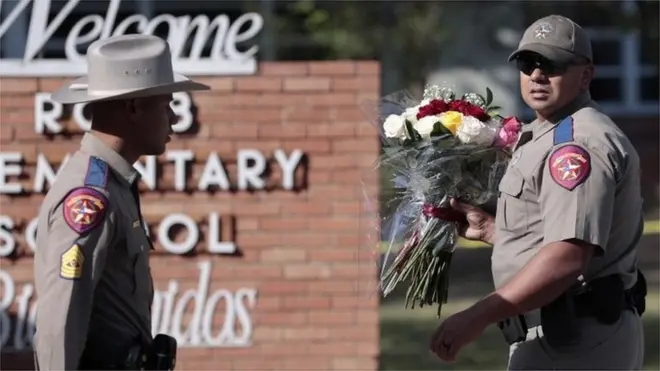 Police lay flowers at the scene