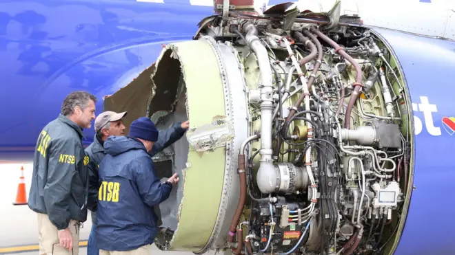NTSB investigators examining damage to the engine of the Southwest Airlines plane in this image released from Philadelphia, Pennsylvania, April 17, 2018