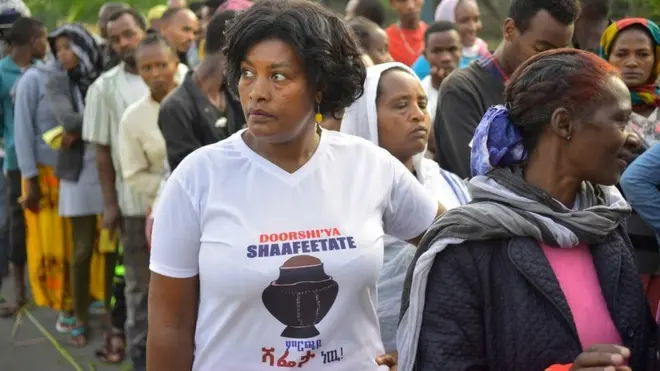 People queuing to vote