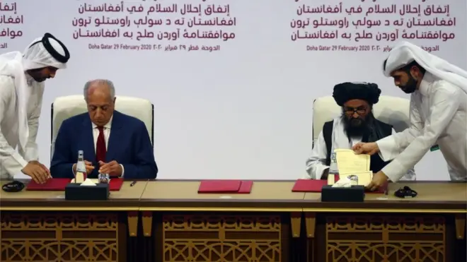 Mullah Abdul Ghani Baradar, the leader of the Taliban delegation, signs an agreement with Zalmay Khalilzad, U.S. envoy for peace in Afghanistan, at a signing agreement ceremony between members of Afghanistan"s Taliban and the U.S. in Doha, Qatar February 29, 2020. REUTERS