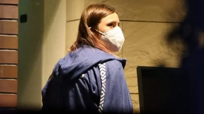 Krystina Timanovskaya walks with her luggage inside the Polish embassy in Tokyo