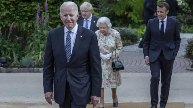 French President Emmanuel Macron, Queen Elizabeth II, British Prime Minister Boris Johnson and United States President Joe Biden arrive at a drinks reception for Queen Elizabeth II and G7 leaders at The Eden Project during the G7 Summit on June 11, 2021 in St Austell, Cornwall, England.
