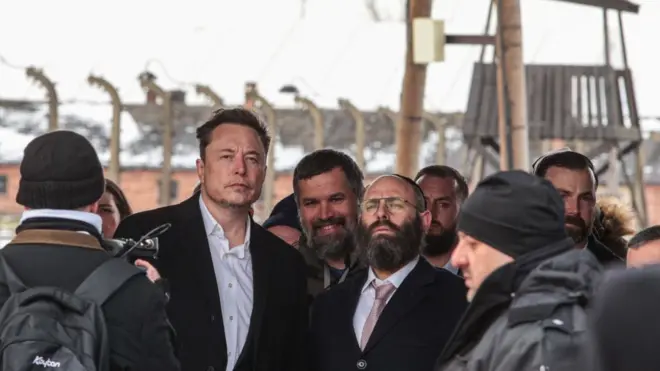 Elon Musk at the site of the Auschwitz-Birkenau Nazi German death camp