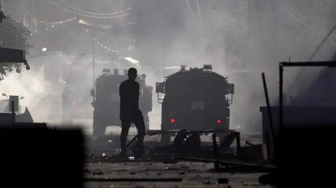 Palestinians clash with Israeli military forces in Jenin, the occupied West Bank, 3 July 2023