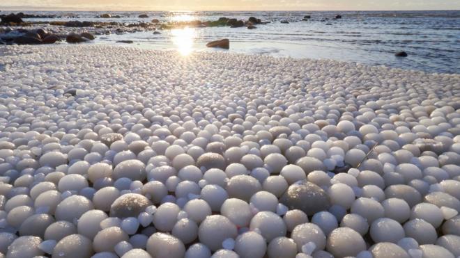Picture by Risto Mattila of egg shaped balls on ice in Finland
