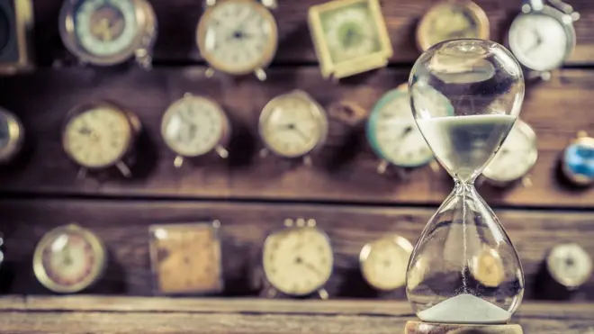 Clocks and an hourglass