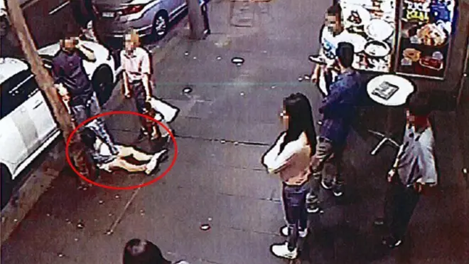 CCTV images show the women lying on the footpath outside the restaurant