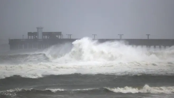 Waves break ashore near rthe Gulf State Park pier as the outer bands of Hurricane Sally come ashore on September 15, 2020 in Gulf Shores, Alabama