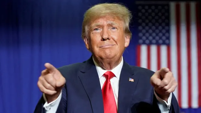 Donald Trump gestures during a rally in Michigan