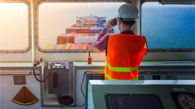 Ship pilot watching the shipping lane
