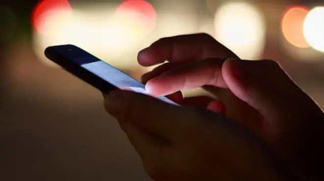 person holding smart phone