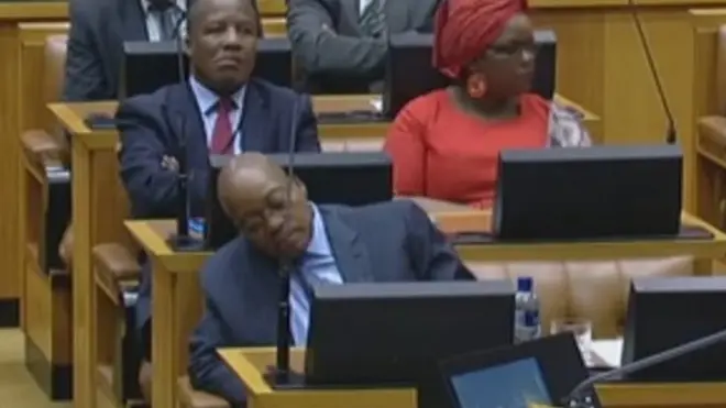 Zuma shown with head down in parliament