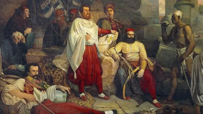 صورة لأعضاء البعثة الفرنسية التوسكانية ويظهر شامبليون جالسا بلحية وسيف أهداه له محمد علي والي مصر