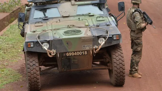 Soldier wey stand beside military tanker