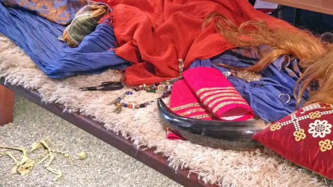 A museum display gives a sense of what the Viking woman's boat grave in Gamla Uppsala may have looked like - similar to the tombs the fragments were found in