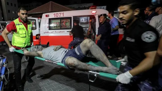 An injured Palestinian upon arrival at al-Shifa hospital in Gaza City on 10 October 2023