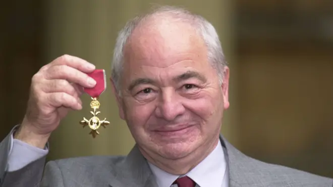Colin Dexter receiving his OBE in 2000