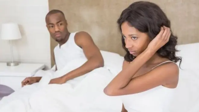 Couple wey dey on top bed.